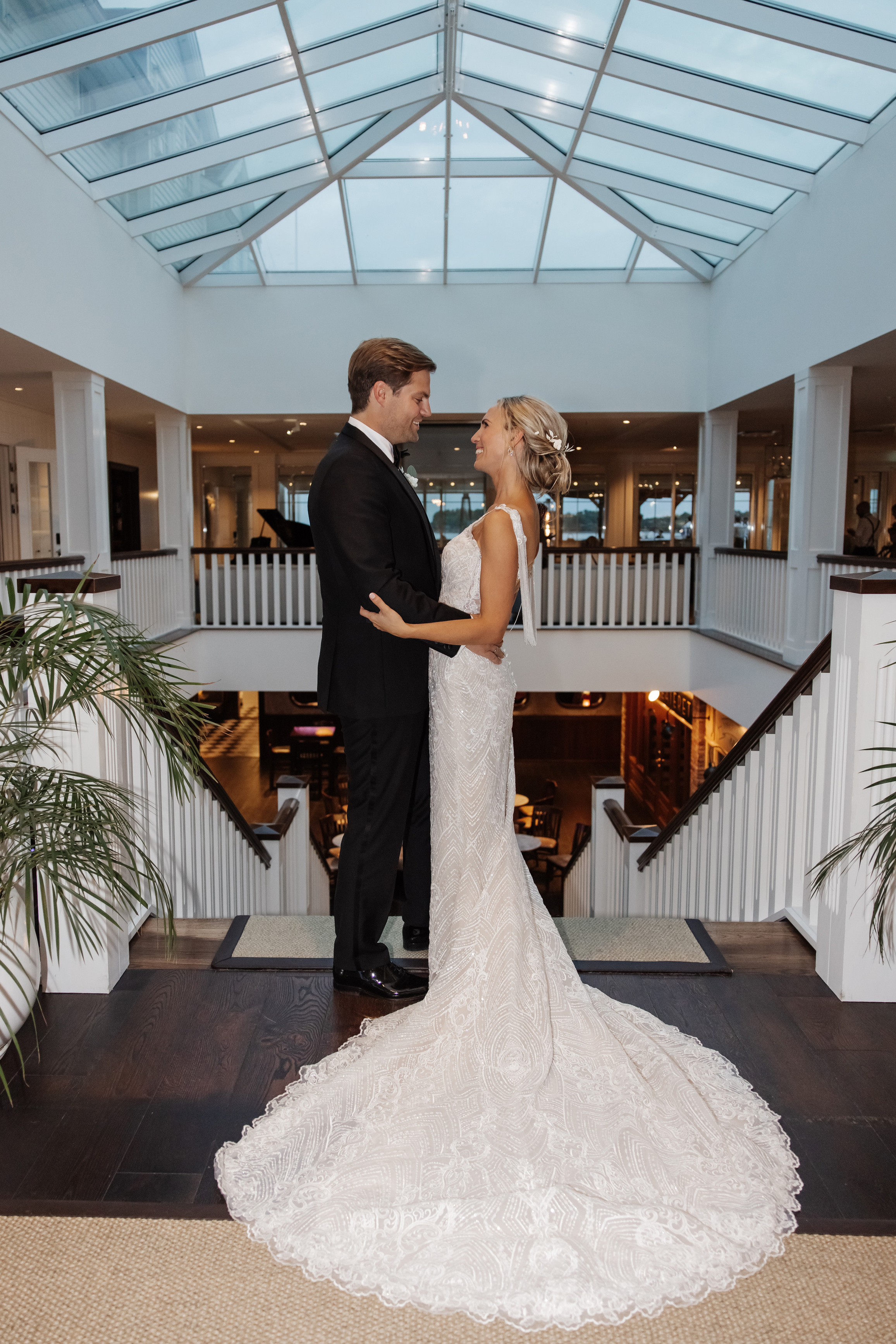 The groom looks at the bride, a beautiful photo session in a photo studio in Tallinn